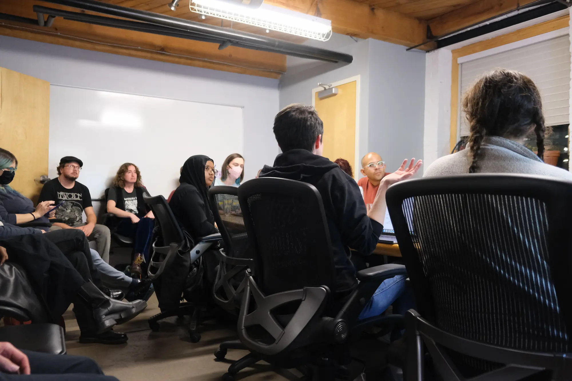 board members seated at a conference table in the our streets office