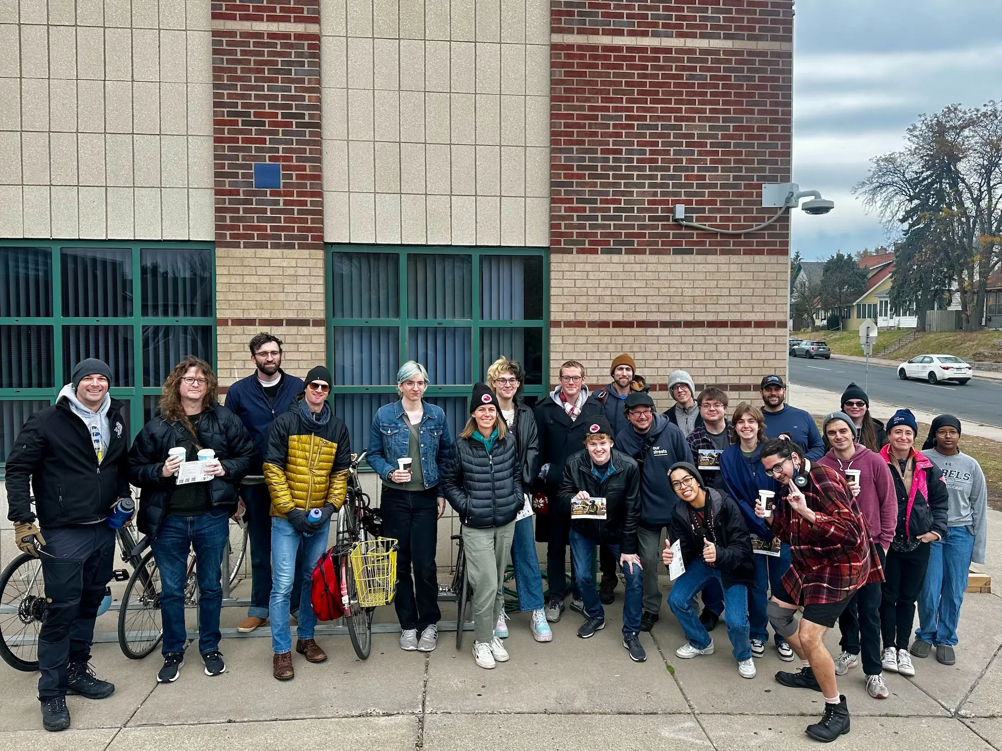 group of canvassers with lit smiling for a group photo