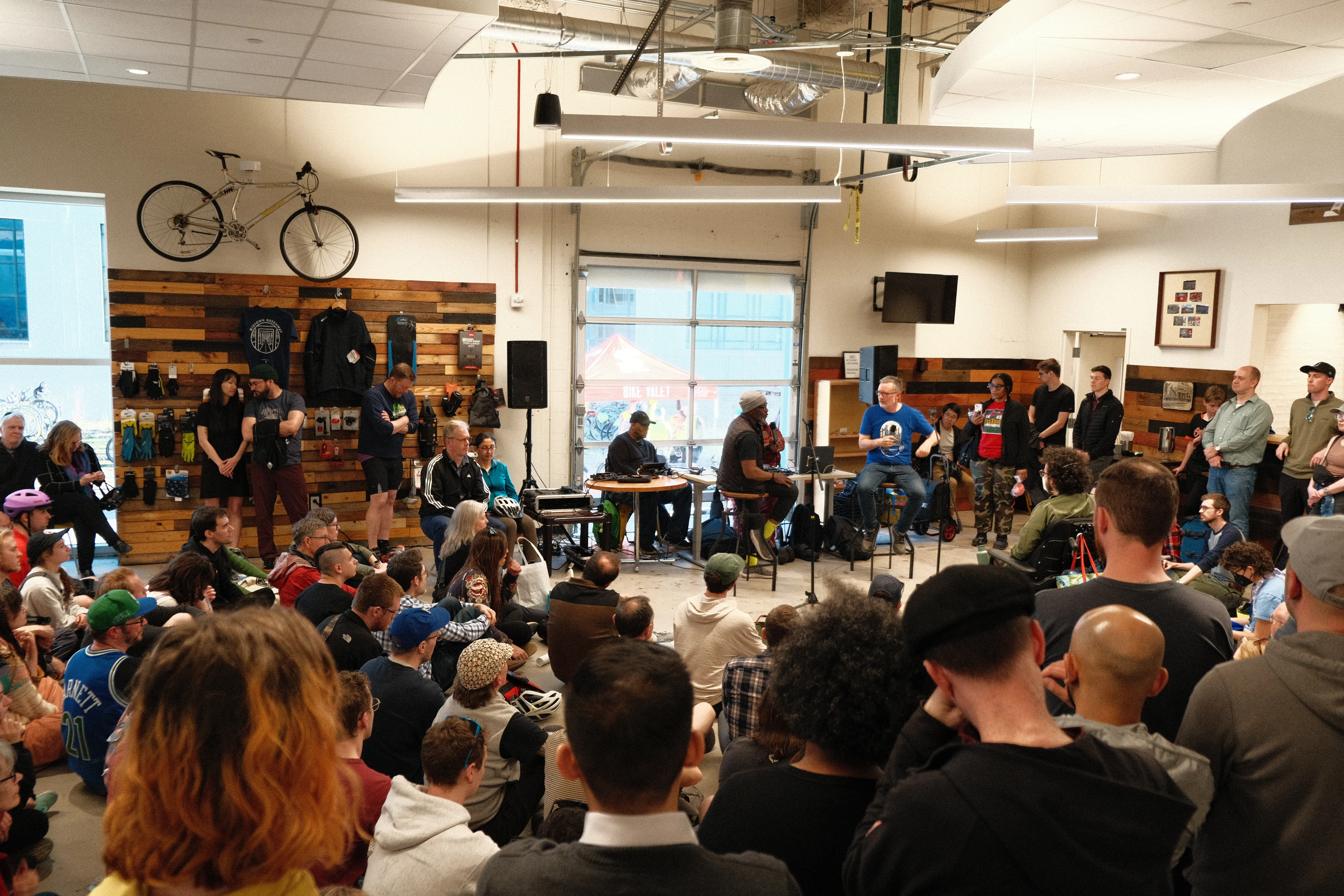 crowd listening to Anthony Taylor interview CityNerd at Venture Bikes