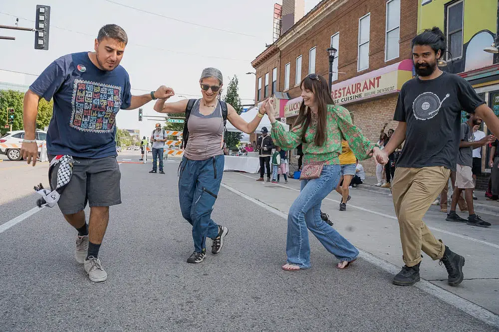 Imagine Cedarfest attendees dancing in the street, an emblem of joy activism